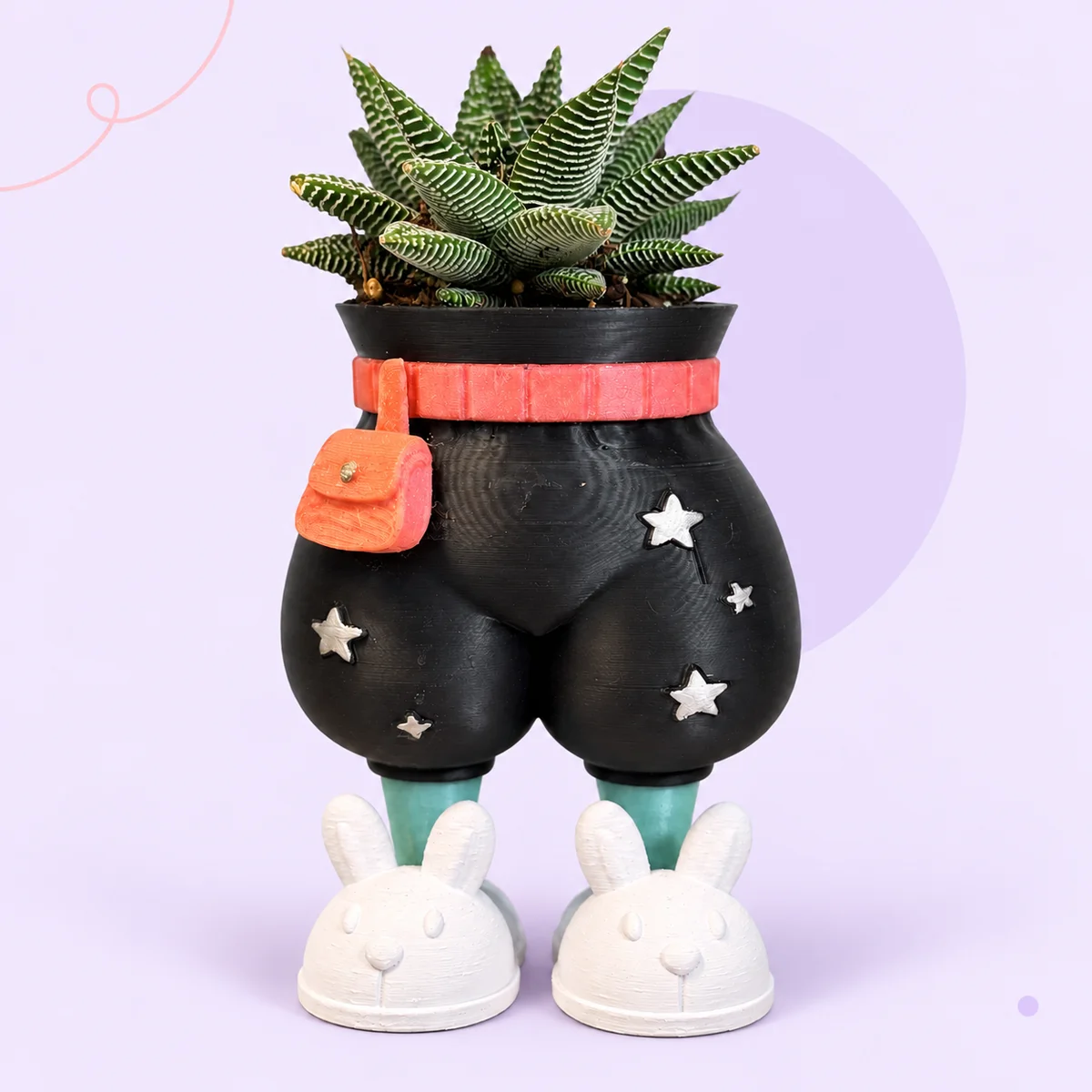 Black Big Chill pants planter with a wide rounded silhouette, coral belt and bag, silver stars, mint shins and white bunny slippers